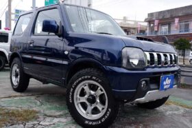 ジムニー 660 XG 4WD ビッグインテ―クの後期型ジムニー本土中古・アルミホイール・タイヤ・テールランプ・クラッツイオシートカバー