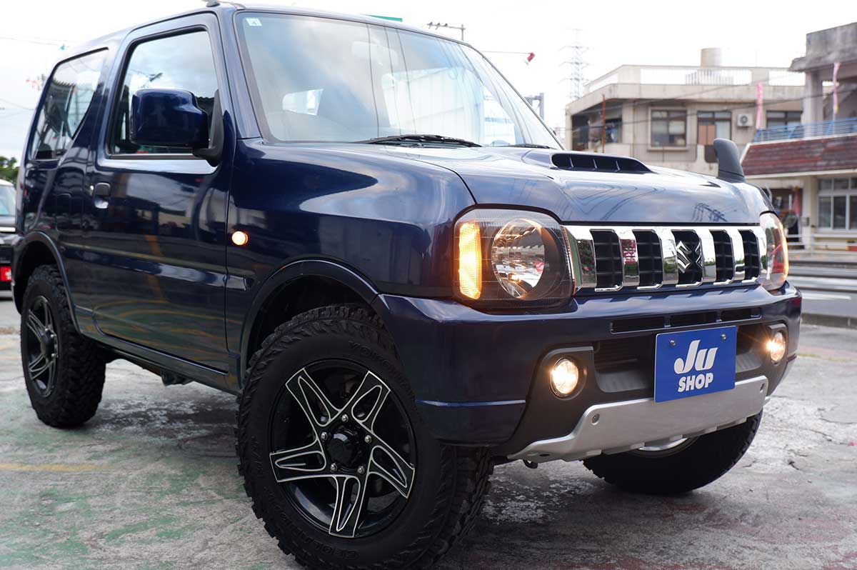 スズキ ジムニー 660 XG 4WD ビッグインテ―クの後期型ジムニー本土中古・アルミホイール・タイヤ・テールランプ・クラッツイオシートカバー