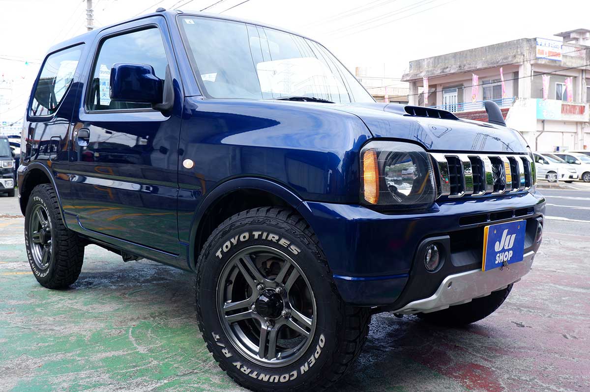 スズキ ジムニー 660 XG 4WD ビッグインテ―クの後期型ジムニー本土中古・アルミホイール・タイヤ・テールランプ・クラッツイオシートカバー