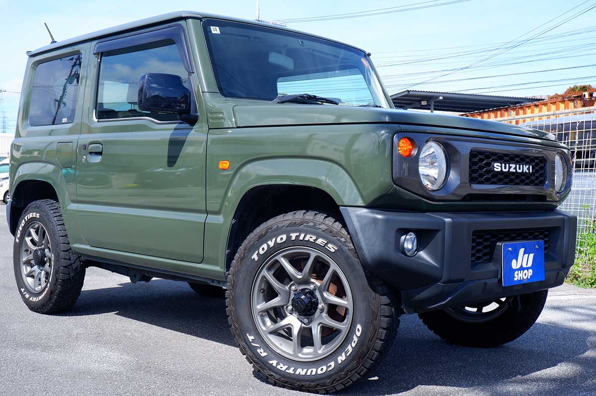 スズキ ジムニー 660 XL 4WD 人気のジャングルグリーンAT車です。XCホイールに185オープンカントリーRTタイヤでカッチョイイ！